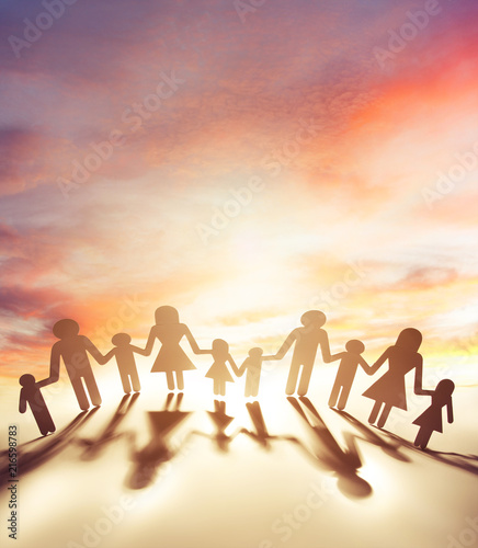 Family united together in front of sunny sky