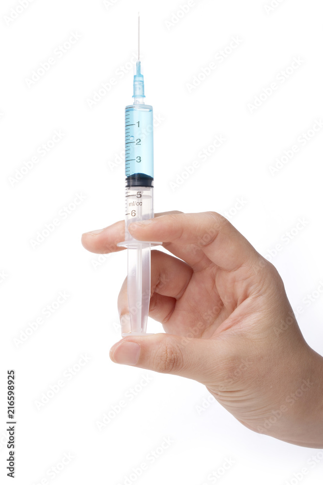 hand hold a syringe isolated white. hand hold a syringe isolated white.