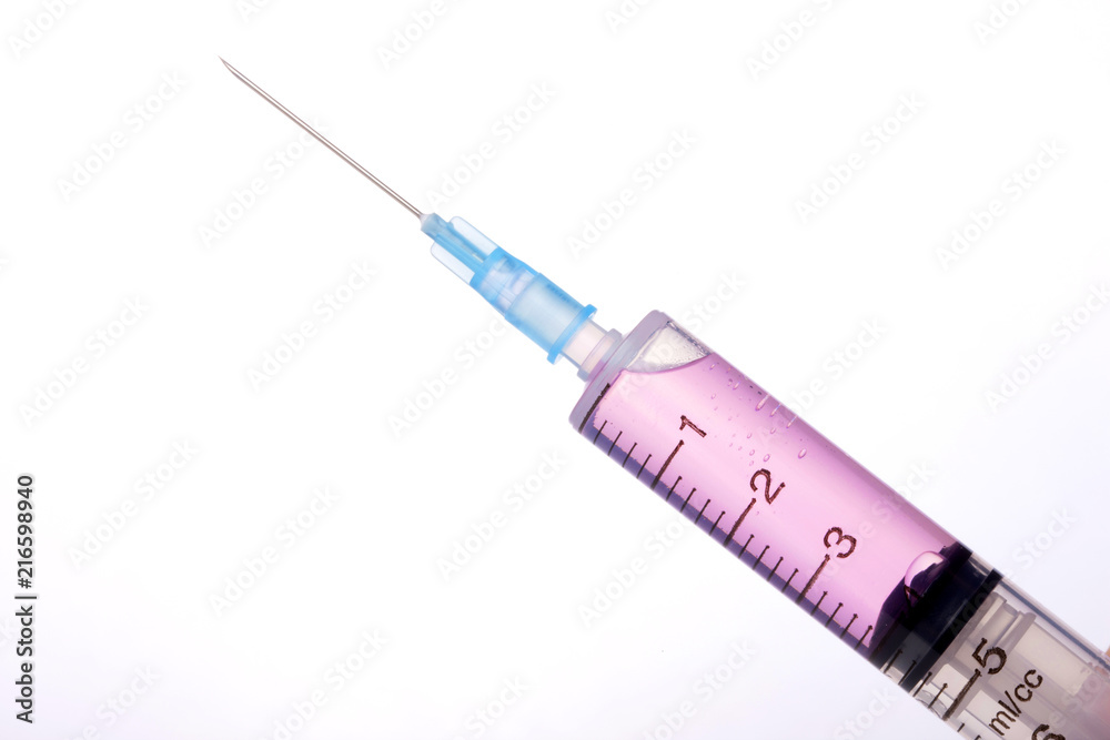 hand hold a syringe isolated white. hand hold a syringe isolated white.