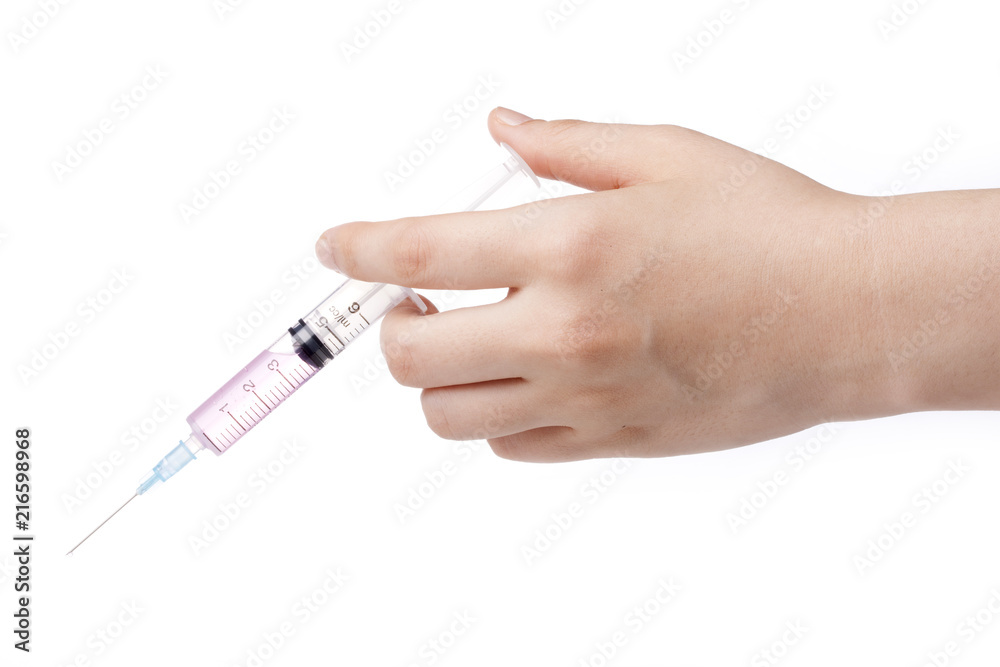 hand hold a syringe isolated white. hand hold a syringe isolated white.