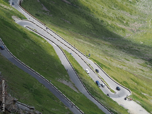 Road to the Stelvio mountain pass in Italy. Amazing view at the mountain bends creating beautiful shapes photo