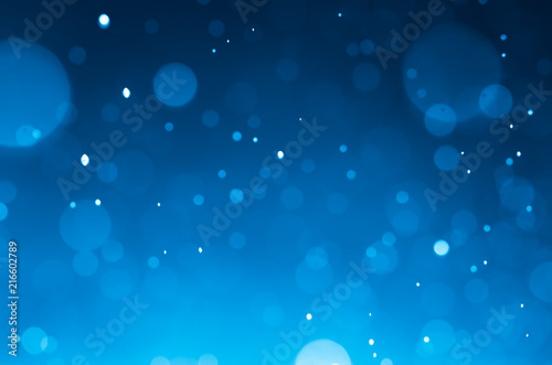 Dark blue abstract backgrounds with bokeh.