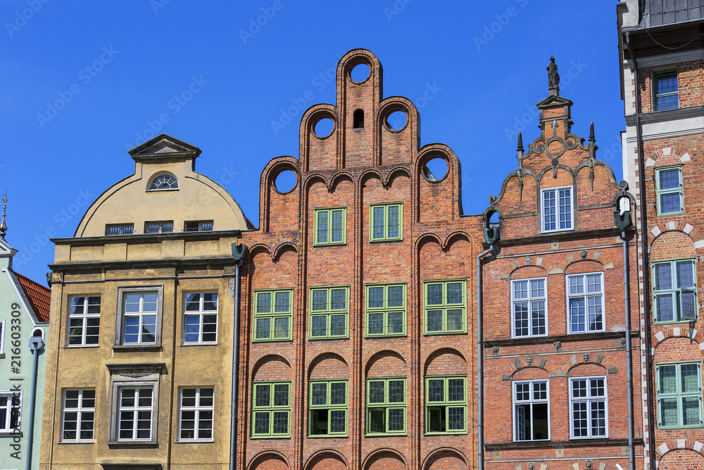 Old colorful tenement houses at Long Embankment street; boulevards on the Motlawa River; Gdansk, Poland