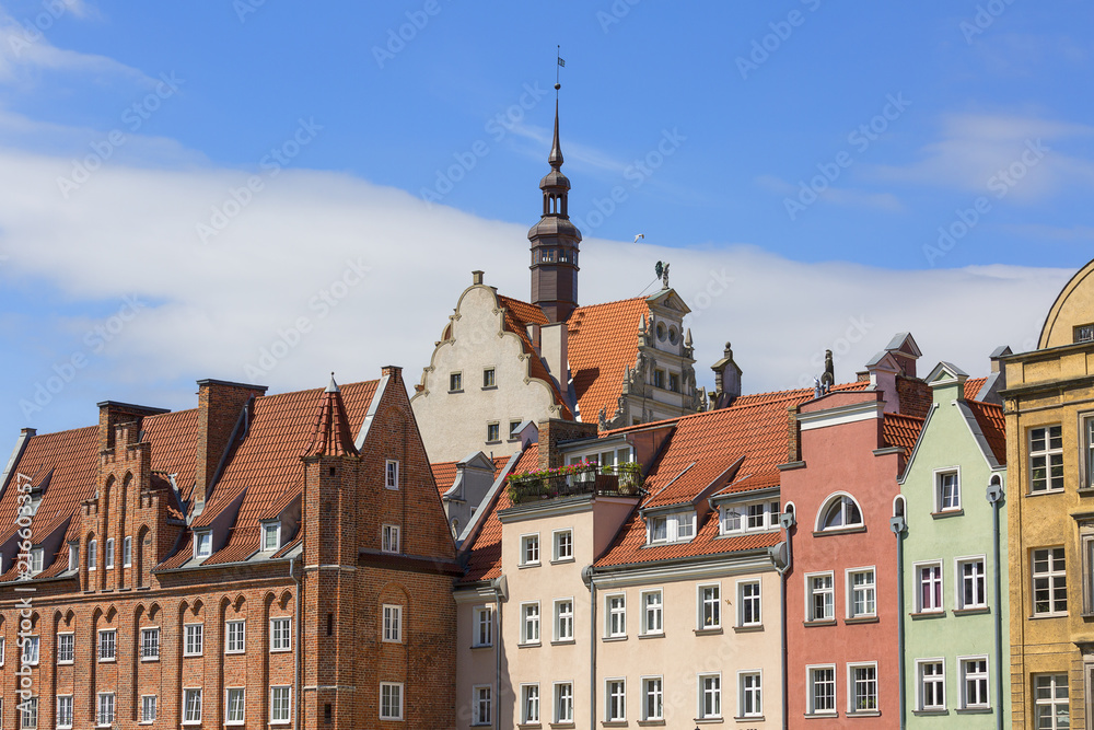 Old colorful tenement houses at Long Embankment street; boulevards on the Motlawa River; Gdansk, Poland