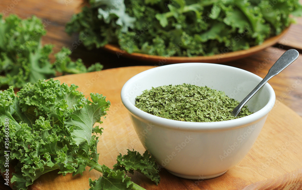 Chopped dry kale leaves on rustic background Chopped dry kale leaves on rustic background