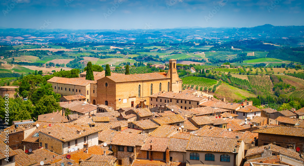 Aerial view of medieval tuscan town with church, San Gimignano, Tuscany, Italy.