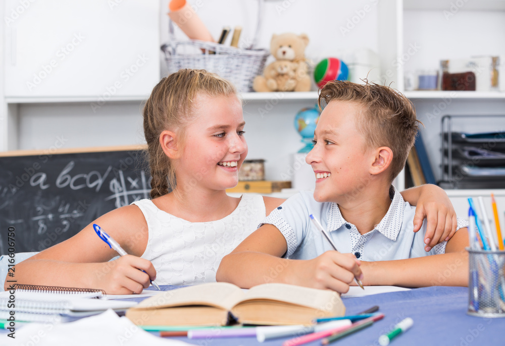 Fototapeta premium Brother with sister are doing homework