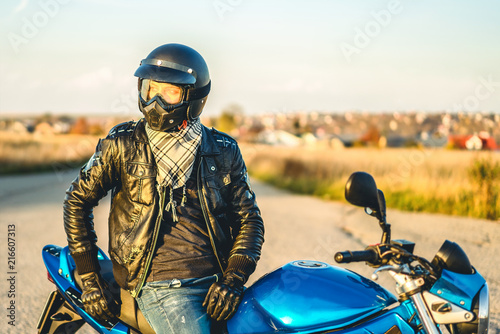 Fototapeta Naklejka Na Ścianę i Meble -  Man on sport motorcycle outdoor on the road