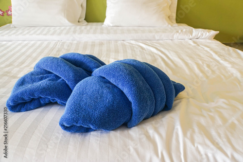creative design blue towel on bed in luxury hotel for shower © jummie