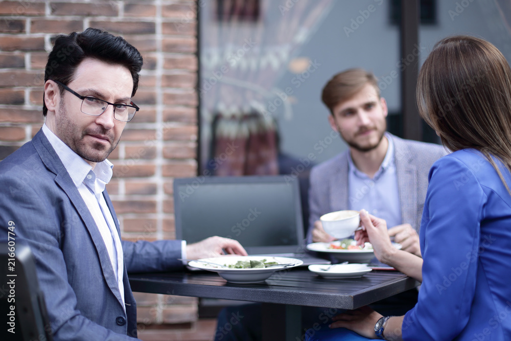 modern businessman on the background of the cafe