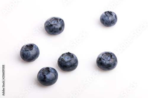 many blue berry on the wood table, whitebackground.
