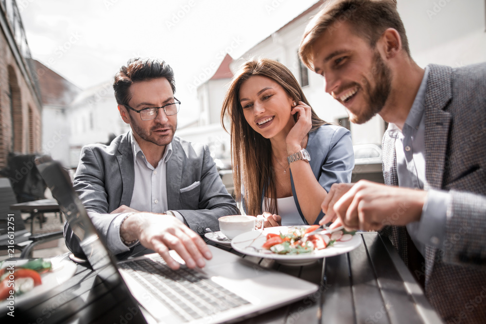 close up.business team sitting at a table in a street cafe close up.business team sitting at a table in a street cafe