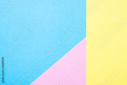Blue, yellow and pink paper background. 