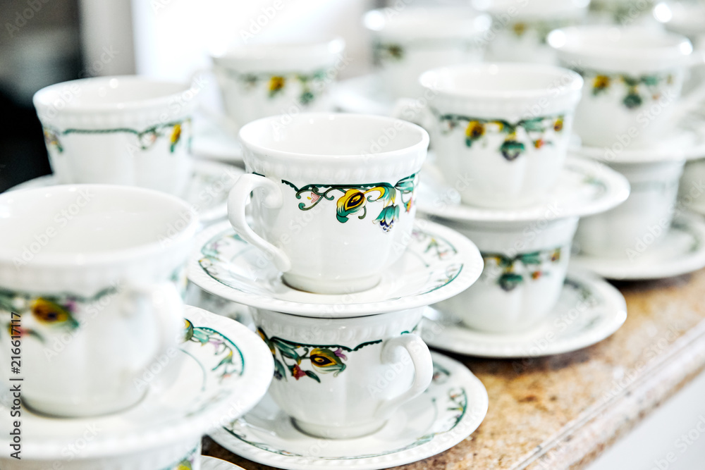 cups and saucers in a number