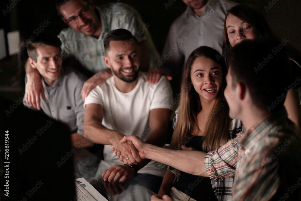 Fototapeta premium handshake of business people in the circle of colleagues