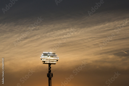 Stadium lights on sunset background