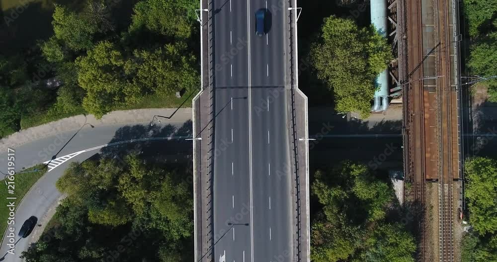 Aerial Vertical Of Traffic Overpass And Railway Bridge. Flying Up Aerial Vertical Of Traffic Overpass And Railway Bridge. Flying Up