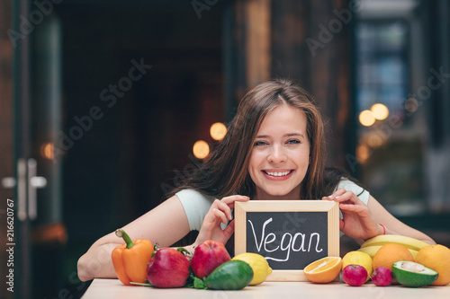 Smiling attractive woman with a plate