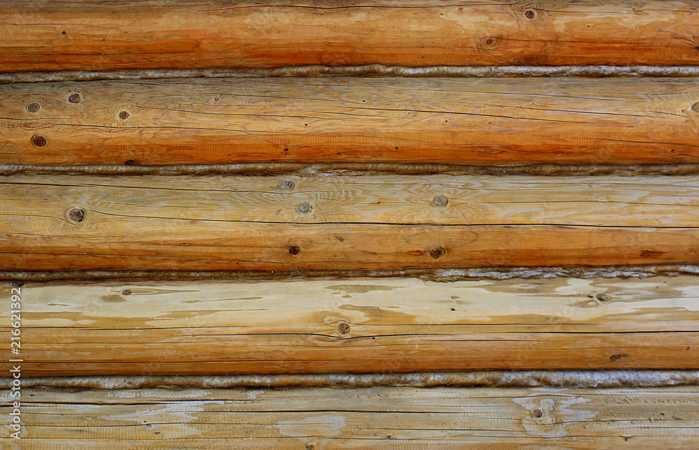 texture of the wooden logs lie in the dol yellow color