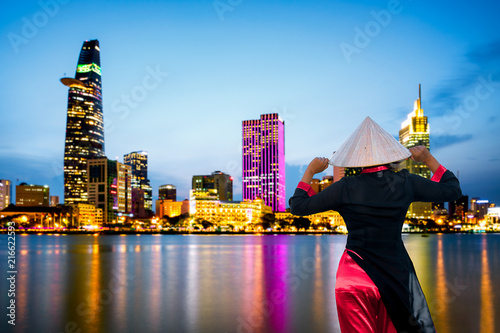 Vietnam woman wearing Ao Dai culture traditional at Ho chi minh city in Vietnam.