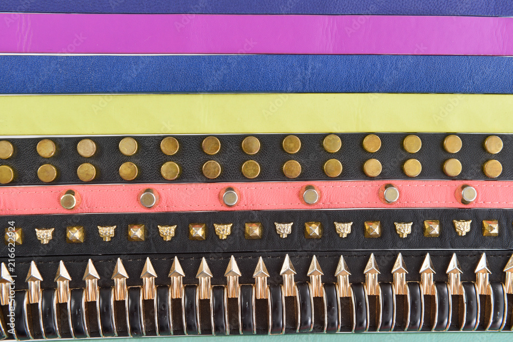 Set of many color, rivets belts background
Set of many color, rivets belts background
