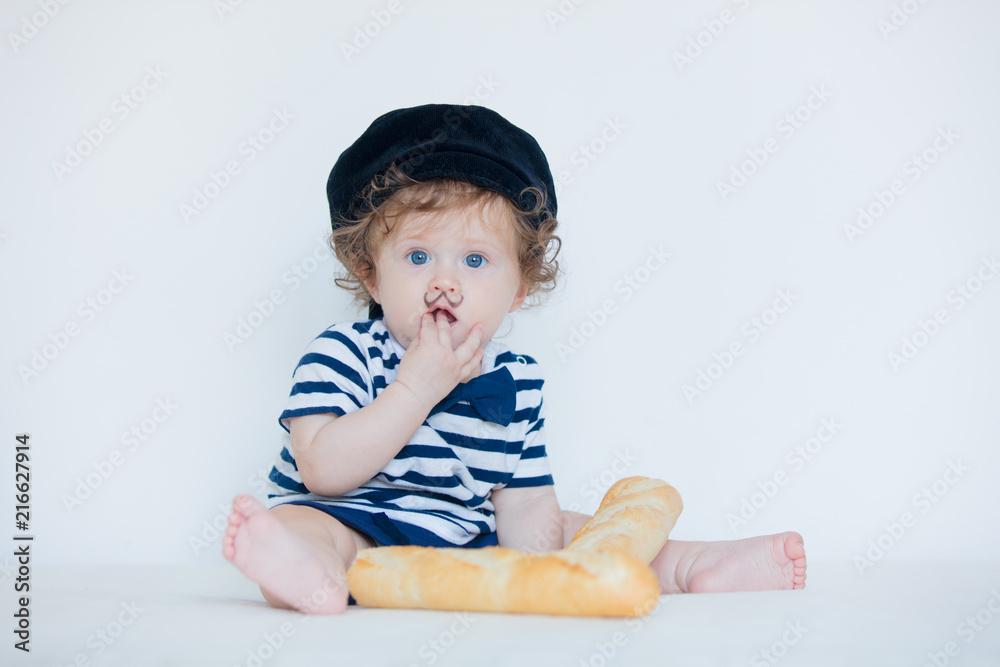 Little baby with mustache, beret and baguette on white background. Little baby with mustache, beret and baguette on white background.
