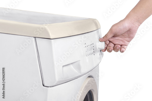 Closeup of man hands adjusting washing machine program