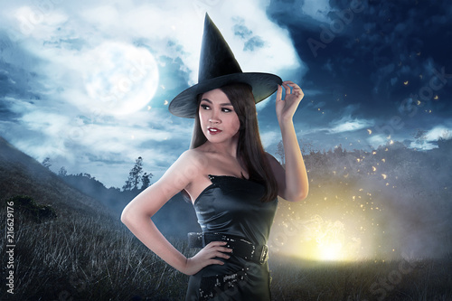 Beautiful asian witch woman with hat