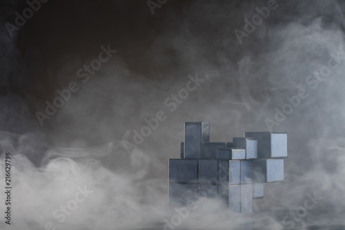 Картината върху платно Rubik's cube on the dark or wooden background with smoke