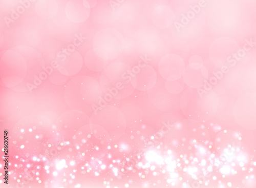 Abstract pink blurred light background with bokeh and glitter effect.