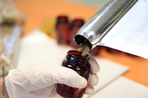 Pharmacy use pill counting tray for pouring out pills to the bottle in drugstore.