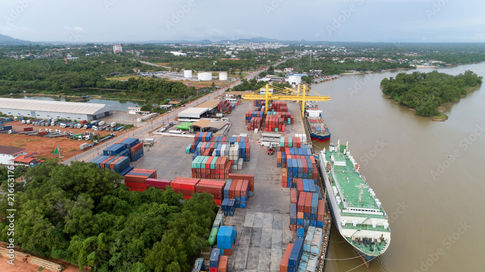 Aerial view drone shot of Container ship in export and import logistics, Shipping cargo in thailand.