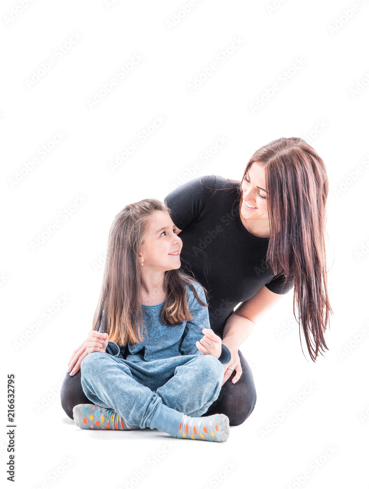 Loving mother and her daughter child girl playing and hugging on white background. Concept of happy. Studio shoot Loving mother and her daughter child girl playing and hugging on white background. Concept of happy. Studio shoot