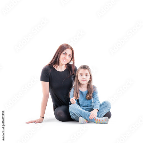 Loving mother and her daughter child girl playing and hugging on white background. Concept of happy. Studio shoot
