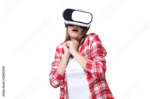 Young woman in virtual reality goggles on white background