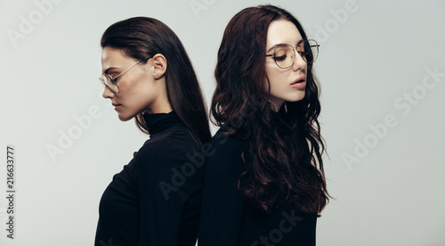 Female models in black outfit and glasses