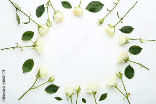 Rose flowers with green leafs on white background