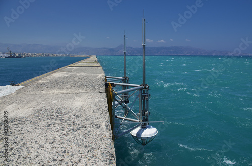 Seascape with Marine research equipment fixed on the concrete pier of Heraklion in Greece in the summer season photo