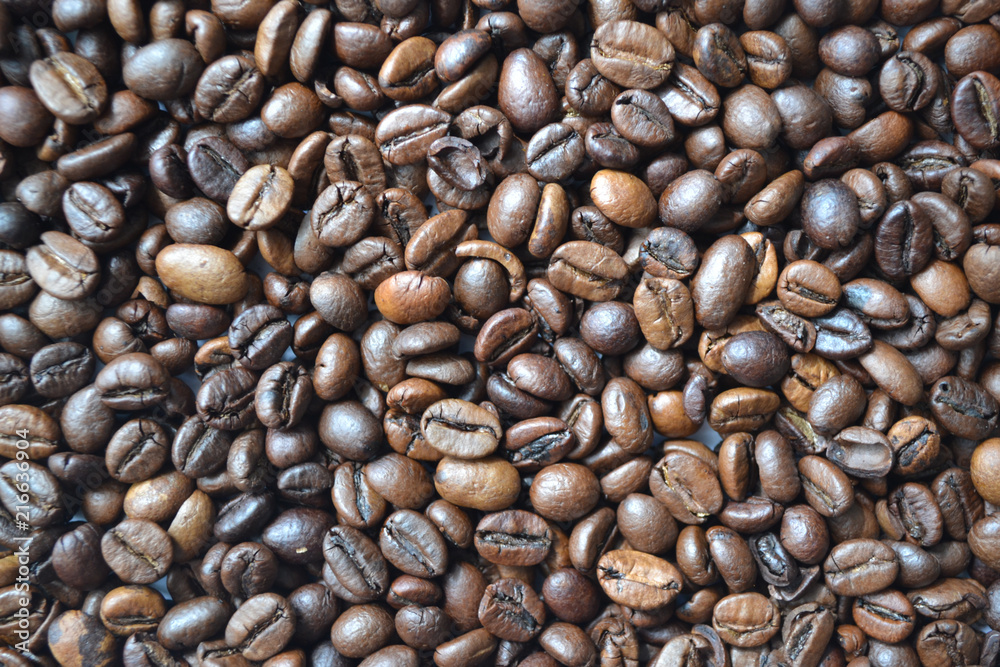 Fototapeta premium Background of aromatic roasted coffee beans used for decorating packages covers banners flyers leaflets.