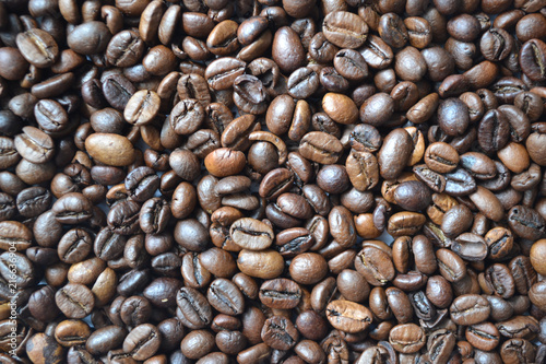Background of aromatic roasted coffee beans used for decorating packages covers banners flyers leaflets.