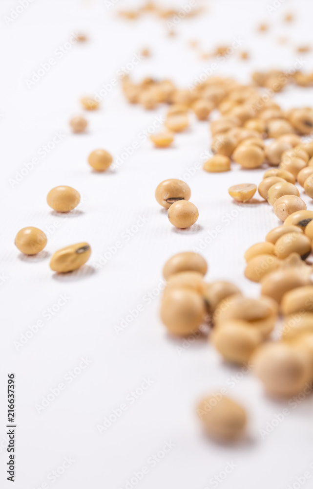 Beans scattered over white background