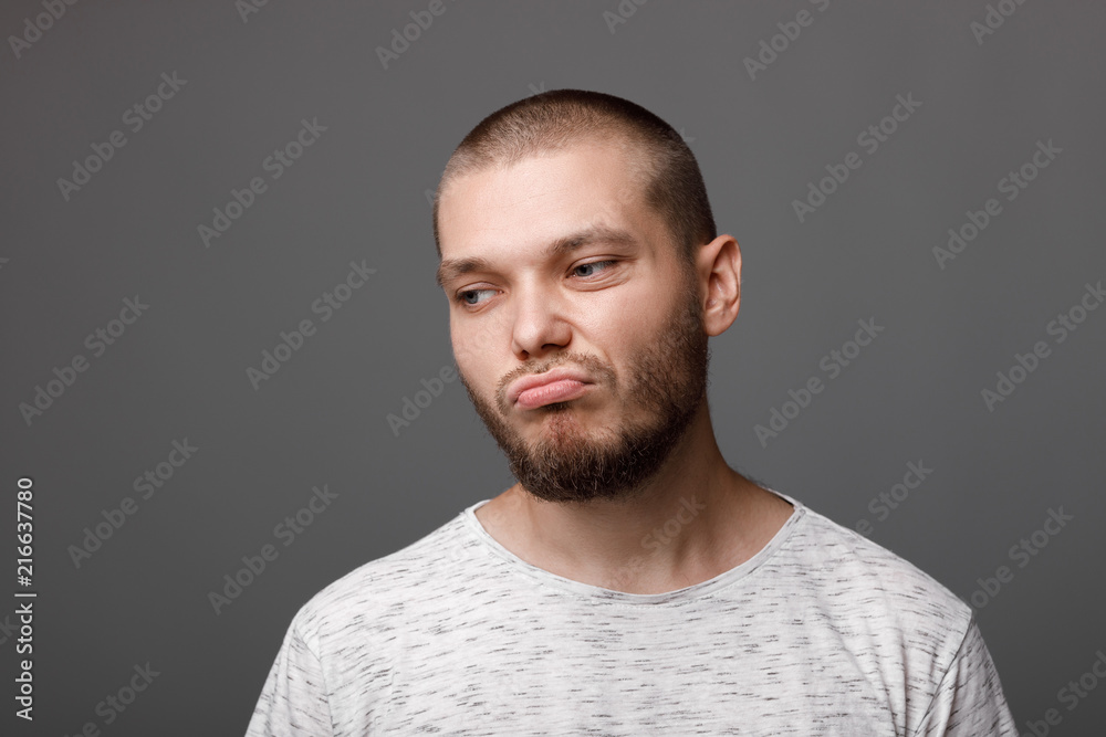Fototapeta premium portrait of dissatisfied young man