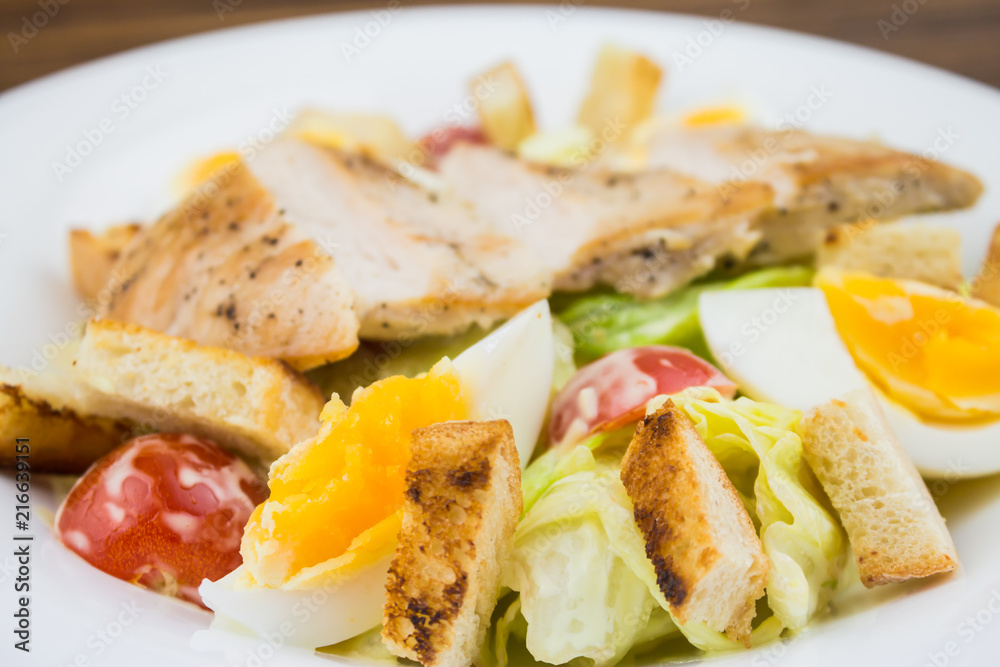 Caesar salad with chicken, close-up