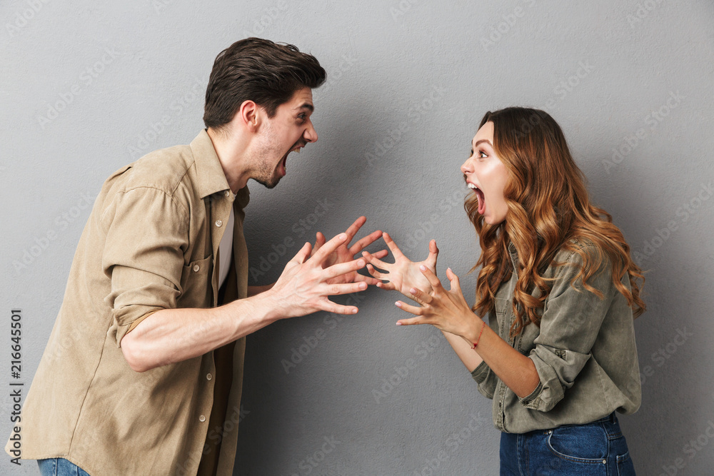 Portrait of an angry young couple having an argument - obrazy, fototapety, plakaty 