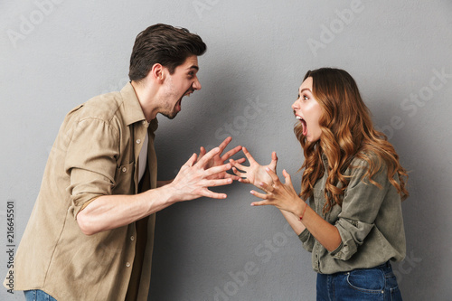 Portrait of an angry young couple having an argument photo