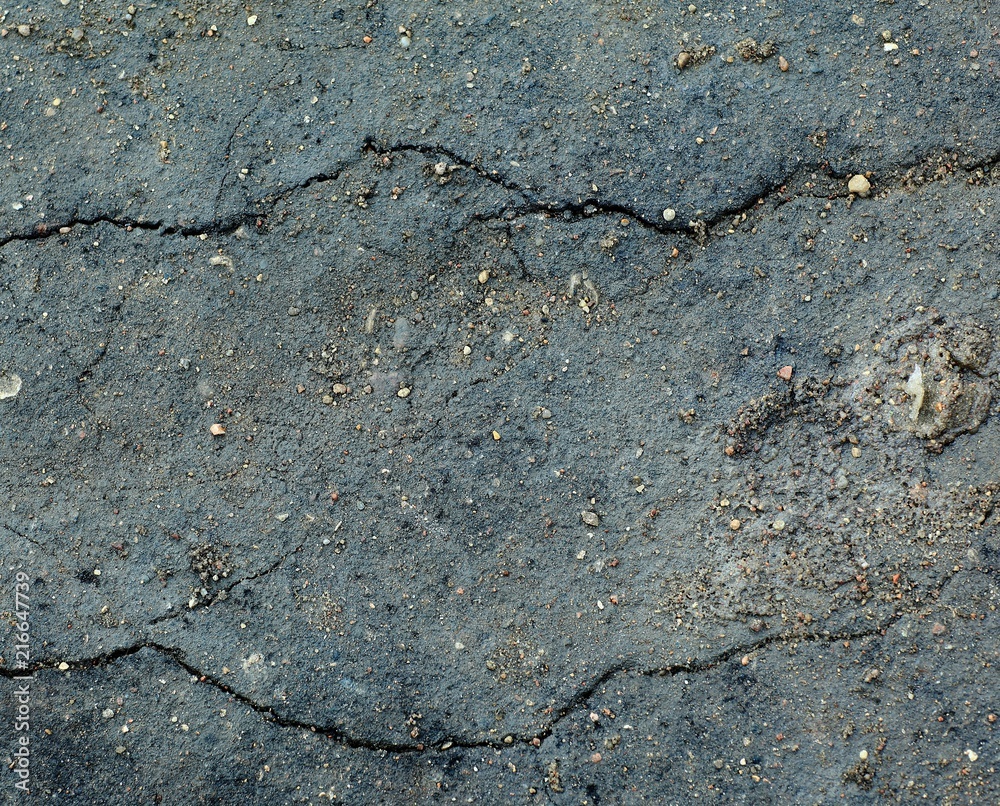 Obraz premium abstract background. cracks in the old asphalt.photo with copy space