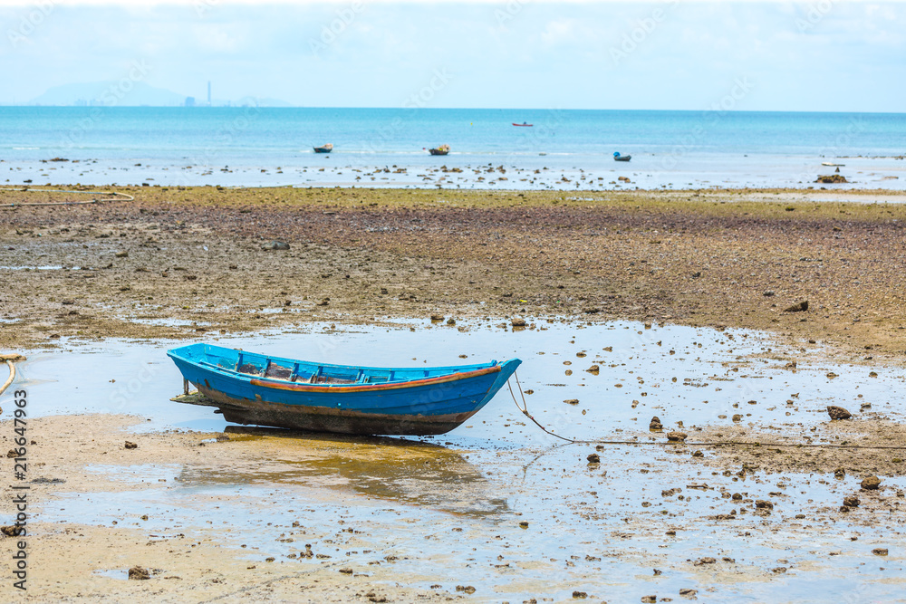 fishing boats. Parking on the sea beach. In the daytime sky.. fishing boats. Parking on the sea beach. In the daytime sky..