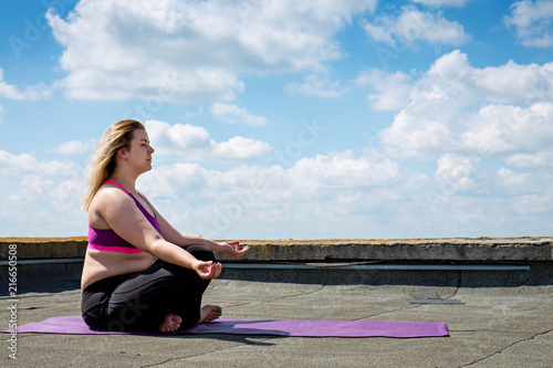 Tableau sur toile Young woman doing yoga, meditation