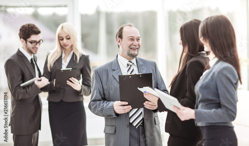 employees discuss their goals before the start of the workshop