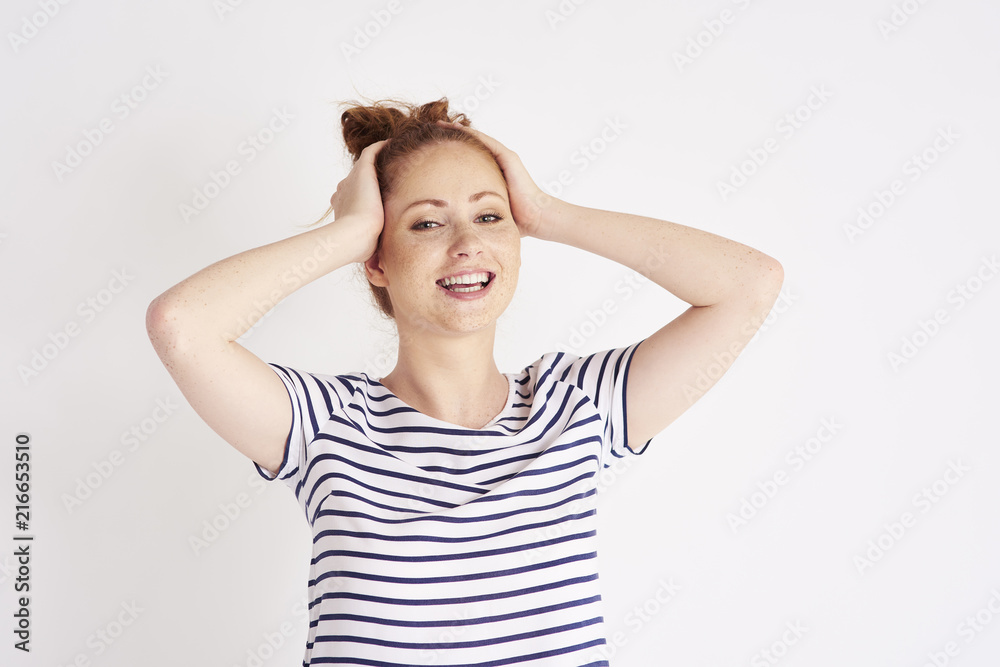 Portrait of beautiful, young woman laughing at studio shot Portrait of beautiful, young woman laughing at studio shot